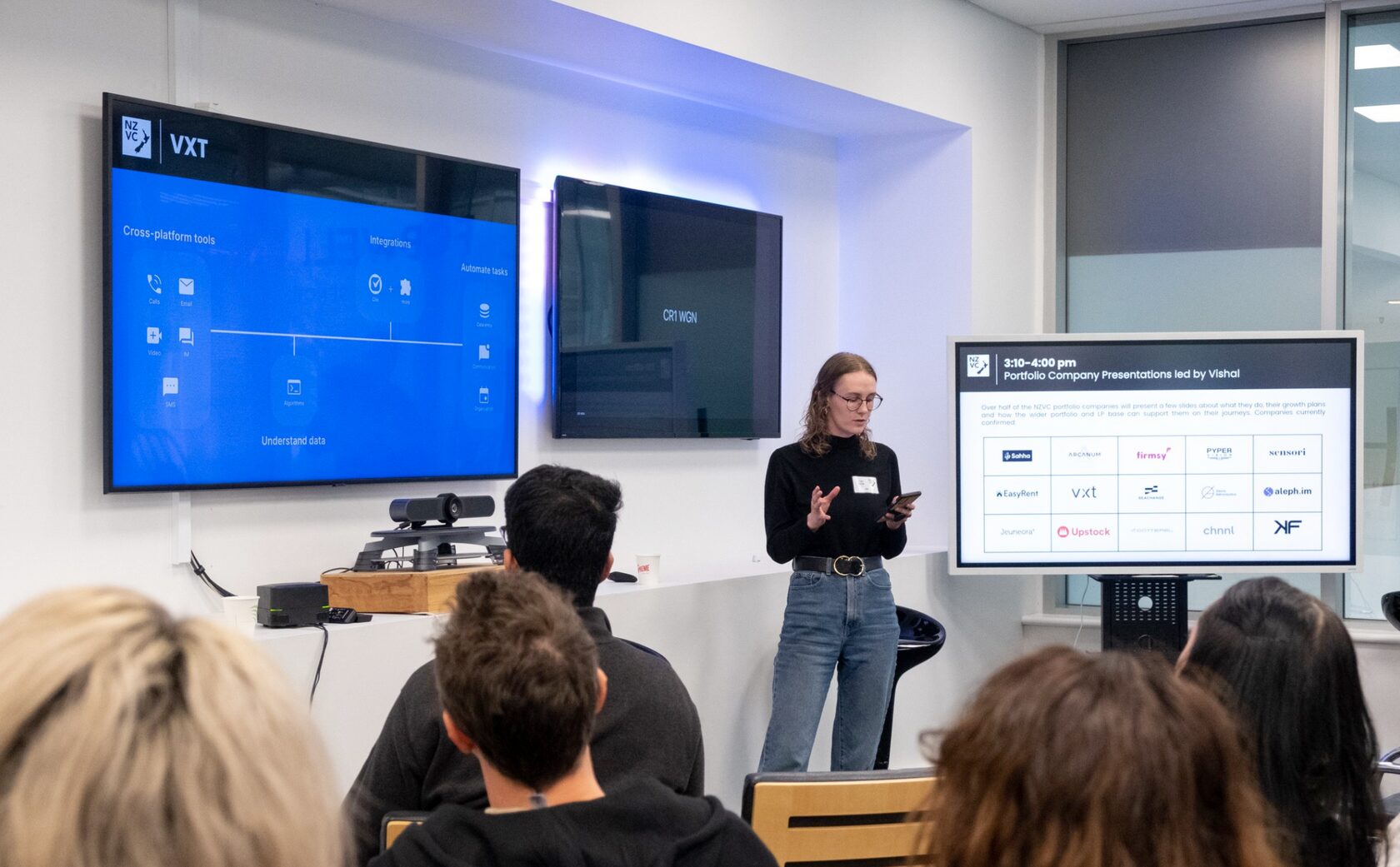 A founder presenting the VXT product on screen at Portfolio Day 2022