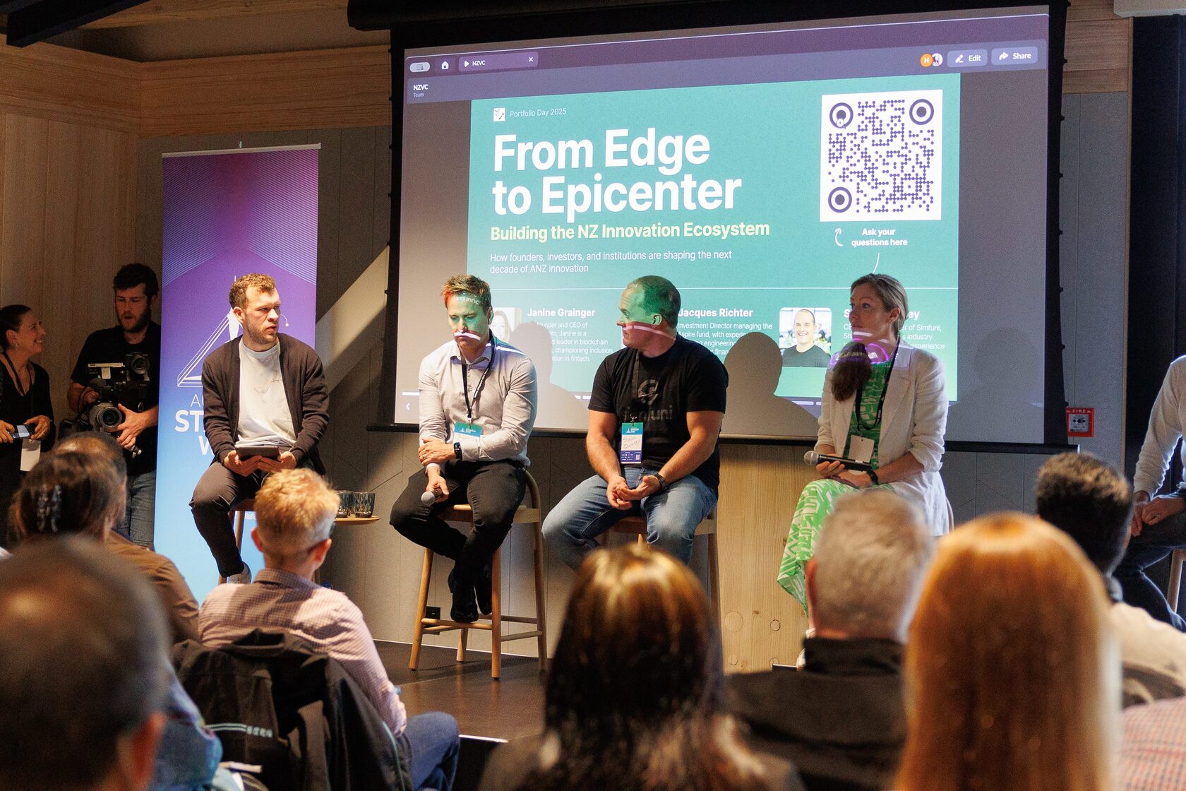 The From Edge to Epicenter panel on stage in front of a seated audience