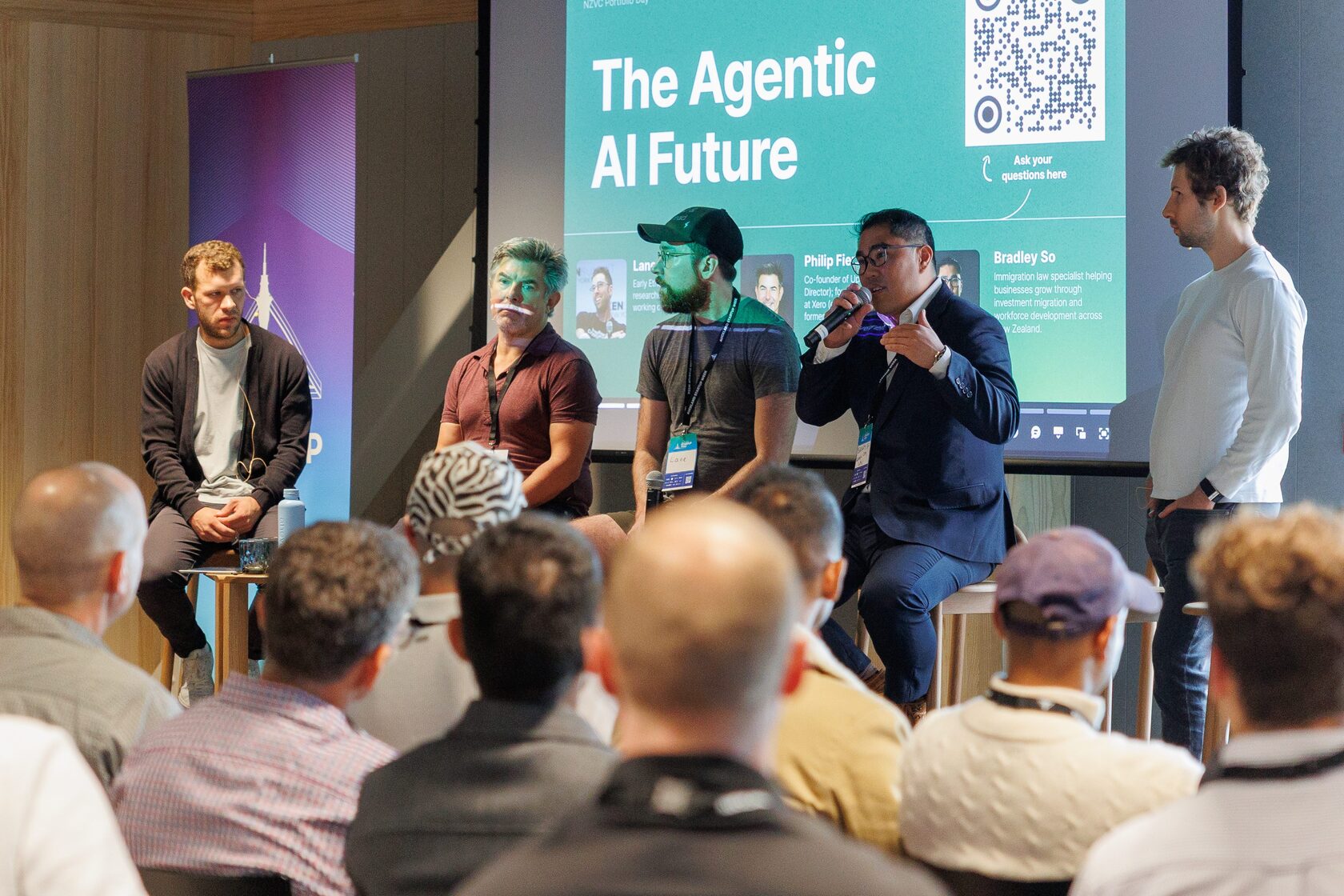 The Agentic AI Future panel on stage in front of a seated audience