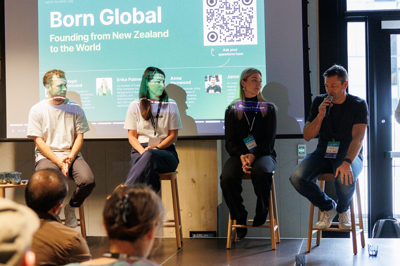 The Born Global panel seated on stage under a slide reading Founding from New Zealand to the World