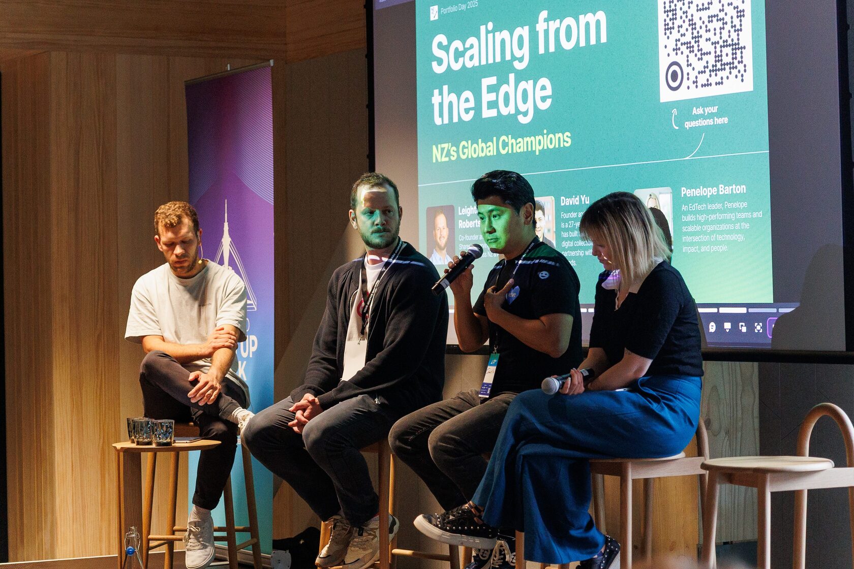Four panelists seated under a slide reading Scaling from the Edge, NZ’s Global Champions