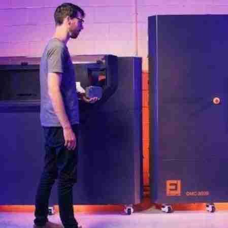 David Moodie stands at one of the Foundry Lab casting machines he designed so a part drawn in the morning is cast by the afternoon.