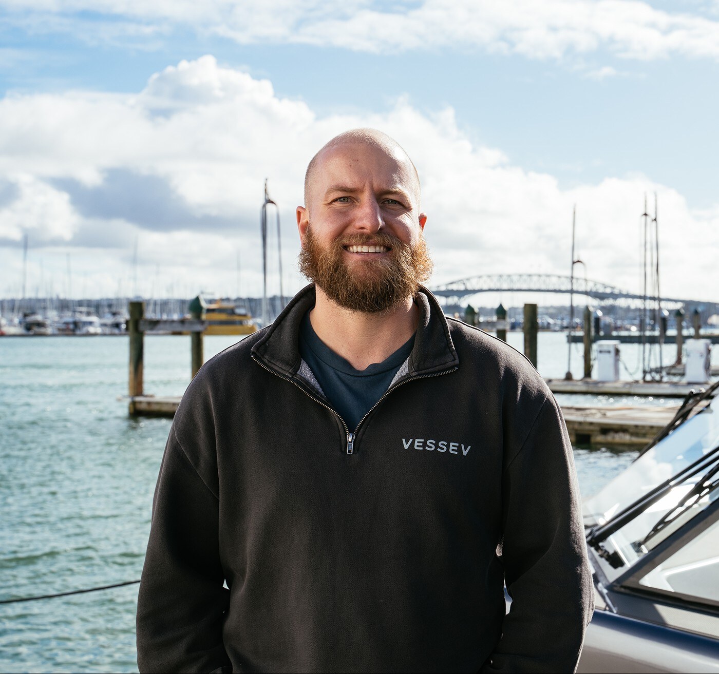 Eric Laakmann, founder and chief executive of Vessev, on the dock beside a VS-9.