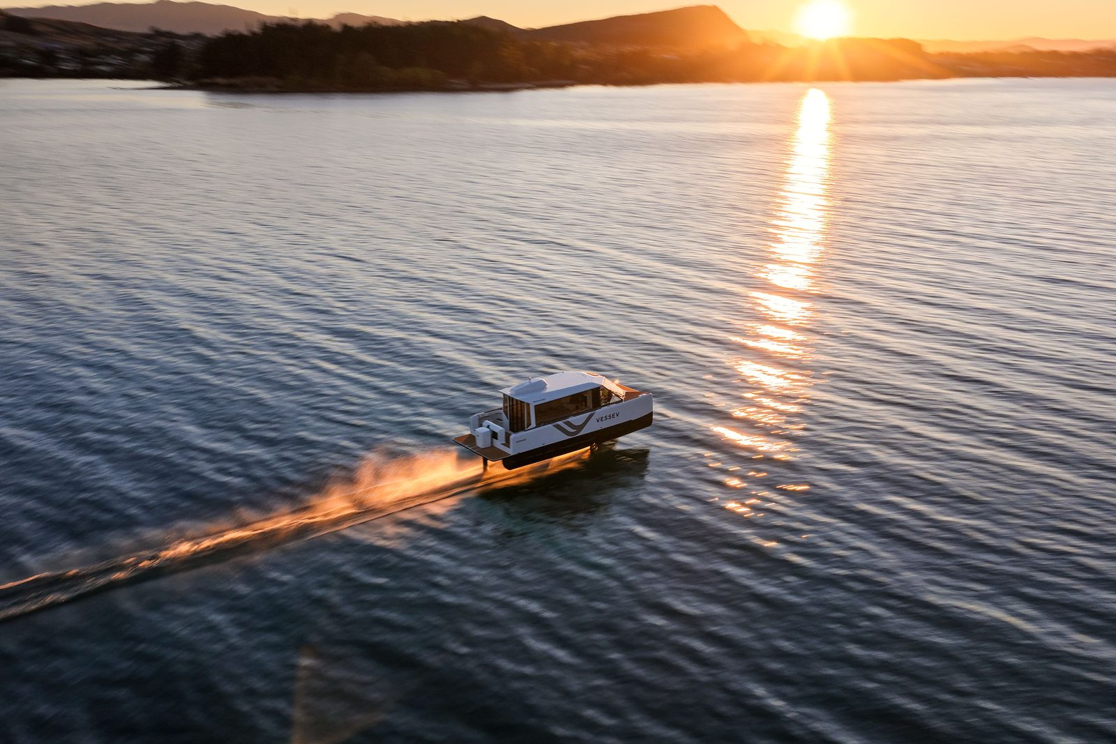 The VS-9 runs at speed with only its foils left in the water.
